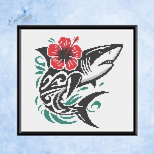 May include: Cross-stitch art of a shark with a red hibiscus flower and tribal design. The shark is black and white, with green accents. The artwork is framed in a black square.