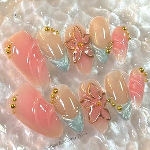 Unhas de pressão florais 3D: unhas elegantes feitas à mão em rosa e azul-petróleo