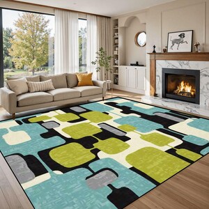 May include: A rectangular rug with a mid-century modern design. The rug features a pattern of overlapping shapes in teal, lime green, black, grey, and cream colours. The rug is placed in a living room with a sofa and fireplace.