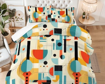 May include: A cream-coloured duvet set with a geometric design featuring teal, orange, yellow, and black shapes. The set includes a duvet cover and two pillowcases, creating a modern and colourful bedroom aesthetic.