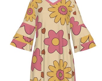 May include: A cream-colored dress with a V-neck and 3/4 sleeves. The dress has a floral print with pink and yellow flowers and brown hearts.
