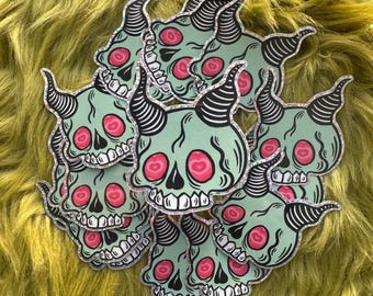 Pegatina espeluznante y linda de calavera con purpurina
