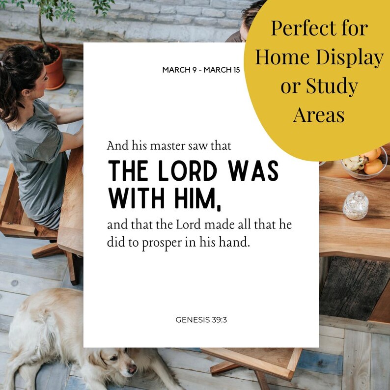 May include: A white rectangular print with the text "THE LORD WAS WITH HIM" and "GENESIS 39:3". The print also includes the text "Perfect for Home Display or Study Areas" and "MARCH 9 - MARCH 15". A golden retriever dog is lying on the floor.