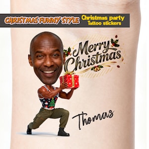May include: A Christmas-themed tattoo sticker featuring a cartoon image of a man holding a red gift box. The text "Merry Christmas" is above the man, and the name "Thomas" is below. The words "Christmas Funny Style" and "Christmas party tattoo stickers" are also present.