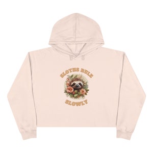 Stay cozy and chic in our Sloth inspired Cropped Hoodie in pink, crafted from soft three-end fleece with double needle topstitching for durability. soft hoodie