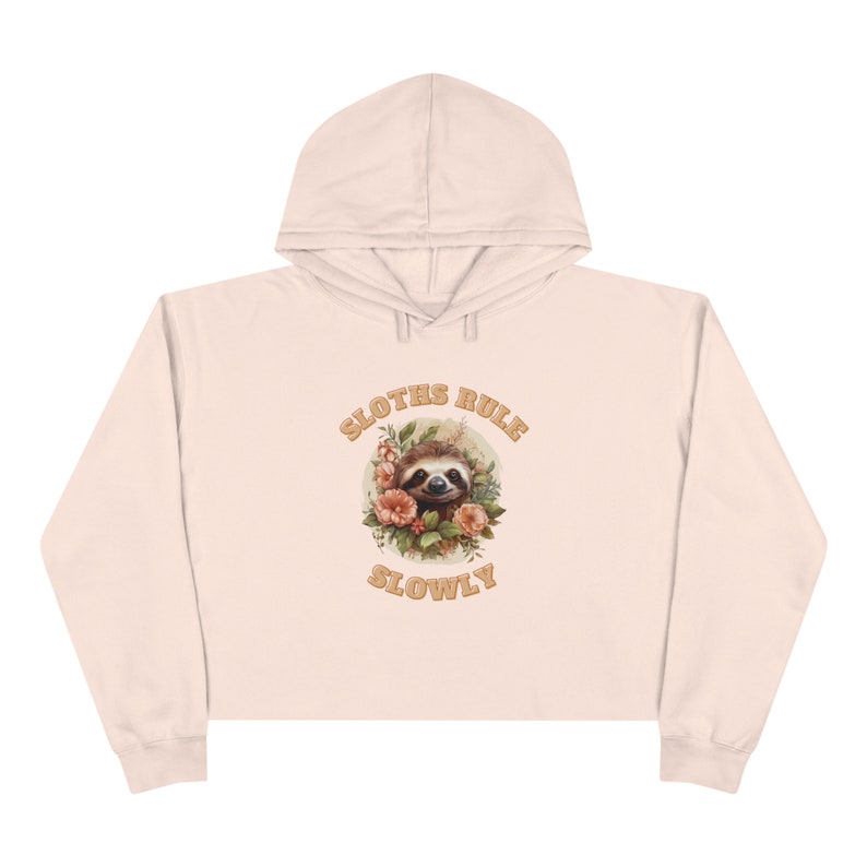 Stay cozy and chic in our Sloth inspired Cropped Hoodie in pink, crafted from soft three-end fleece with double needle topstitching for durability. soft hoodie