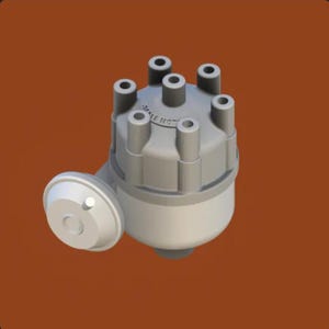 May include: A grey automotive distributor cap with six terminals and the text "SCALE HOT" printed on the top.