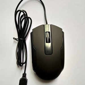 May include: A black wired computer mouse with a scroll wheel and two buttons. The mouse has a USB connector.