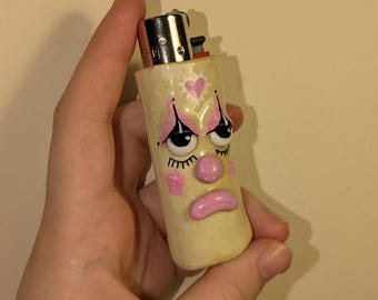 Roze aanstekerdoos droevige clown