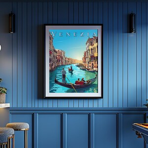 May include: A vintage travel poster featuring a colorful illustration of a gondola on a canal in Venice, Italy. The poster has the word "VENEZIA" in a stylized font at the top.