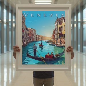 May include: A framed poster with a colorful illustration of a gondola on a canal in Venice, Italy. The poster has the word "VENEZIA" in a stylized font at the top.