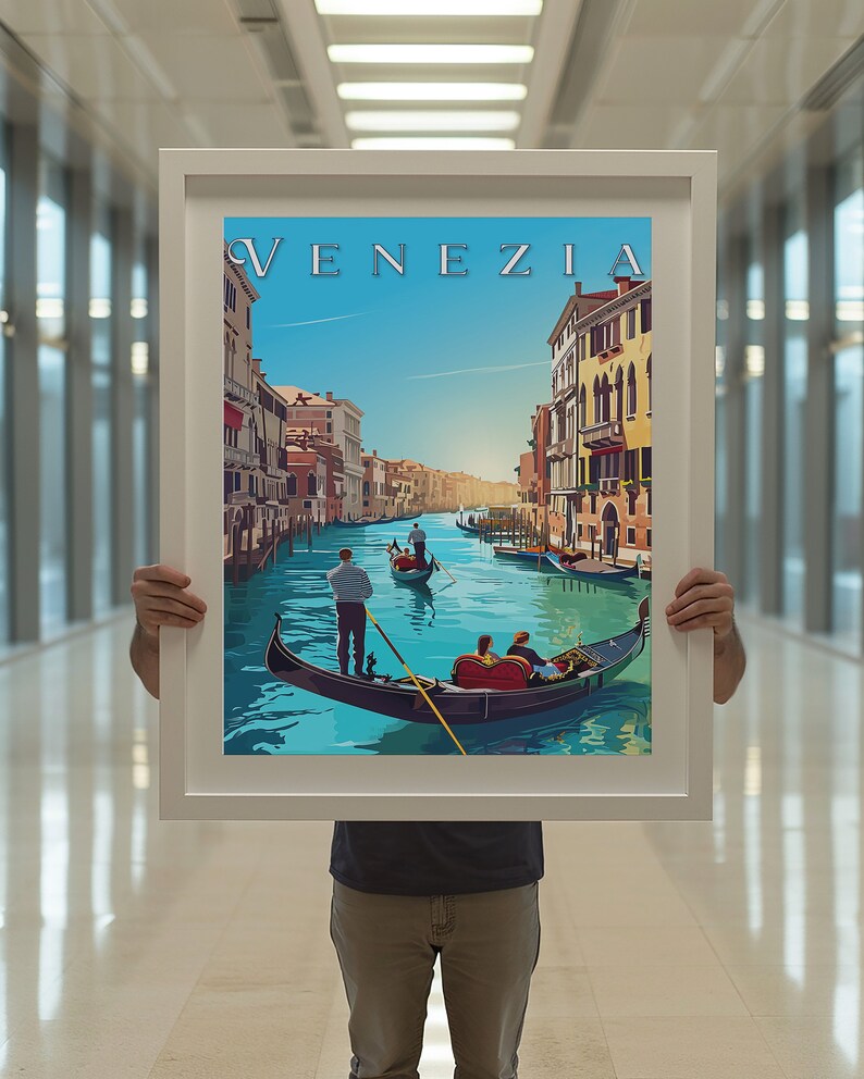 May include: A framed poster with a colorful illustration of a gondola on a canal in Venice, Italy. The poster has the word "VENEZIA" in a stylized font at the top.