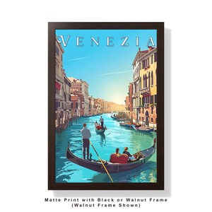 May include: A framed print of a colorful illustration of a canal in Venice, Italy. The print features the text "VENEZIA" in a white font. The canal is filled with gondolas and the buildings on either side of the canal are in a variety of colors.