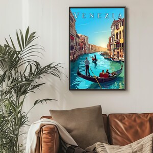 May include: A vintage travel poster featuring a colorful illustration of a canal in Venice, Italy. The poster has the word "VENEZIA" in a black frame at the top. Gondolas are seen on the water with people in them.