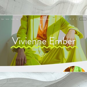 May include: A website homepage featuring a woman wearing a bright yellow suit. The text "Vivienne Ember" is displayed in a large, white font with a wavy green underline. The website navigation bar includes links to "About", "Services", "Portfolio", "Blog", and "Contact Me".