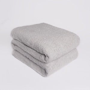 May include: A soft, gray, plush throw blanket folded in half. The blanket is made of a fuzzy, textured material.