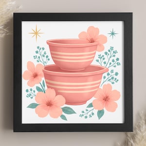 May include: A framed print featuring two stacked pink mixing bowls with cream-colored stripes. The bowls are surrounded by peach-colored flowers, teal leaves, and starburst accents on a white background. The frame is black.