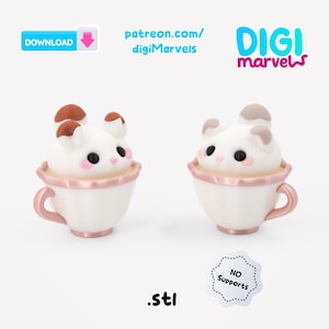 Puede incluir: Dos figuras de gato blanco con manchas marrones sentadas dentro de tazas de t&eacute; de color rosa claro. La imagen incluye el texto DOWNLOAD, patreon.com/digiMarvels, DIGI marvels, .stl y NO Supports. Los gatos tienen ojos negros y mejillas rosas.