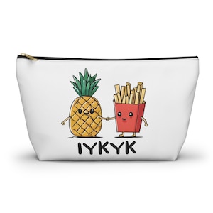 May include: White zippered pouch with a cartoon pineapple and french fries holding hands. The text "IYKYK" is printed below the cartoon characters.