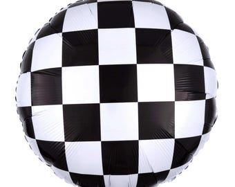 May include: A round, black and white checkered balloon. The balloon's surface is divided into a grid of alternating black and white squares, creating a racing flag design. The balloon is inflated and appears to be made of a shiny material.