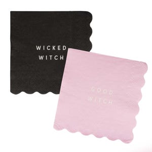 May include: Two square paper napkins, one black and one pink, with scalloped edges. The black napkin reads "WICKED WITCH" in white text. The pink napkin reads "GOOD WITCH" in white text. The napkins are likely for a Halloween or witch-themed event.