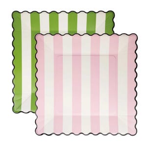 May include: Two square paper plates with scalloped edges. One plate is green with white vertical stripes, and the other is pink with white vertical stripes. The edges are black.