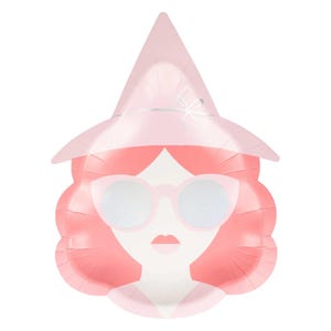 May include: A pink paper plate in the shape of a woman's face, wearing a hat and sunglasses. The woman has pink hair and a light pink hat with a silver bow. The sunglasses have light pink frames and white lenses.