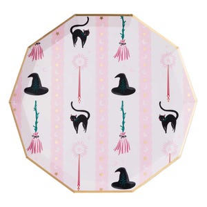 May include: Octagonal paper plate with a gold rim featuring a repeating pattern of black cats, witch hats, brooms, and magic wands on a pink and white striped background. The plate is decorated with gold stars and crescent moons.