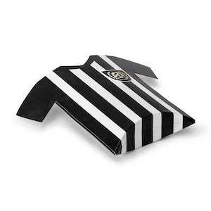 May include: A black and white striped gift box in the shape of a football jersey. The box features a gold emblem and is folded to resemble a jersey. The design is simple and modern, suitable for sports-themed gifts.