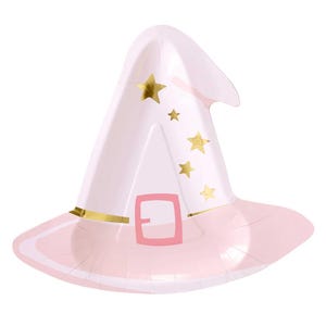May include: A light pink witch hat-shaped paper plate with a wide brim. The hat features a pink buckle, gold trim, and gold star accents. The plate is designed for a party or celebration.