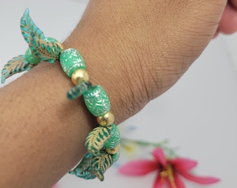 Unique leaf patterned bracelet for nature lovers with intricate design and gold bead accents