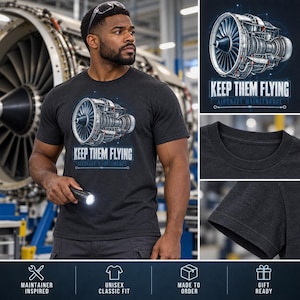 May include: A charcoal gray short-sleeve t-shirt featuring a detailed blue and white graphic of a jet engine. The text "KEEP THEM FLYING" and "AIRCRAFT MAINTENANCE" is printed below the engine illustration in a technical blueprint style.
