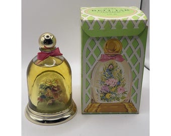 Colonia vintage Avon 1973 en frasco de cristal con diseño floral, llena de 5 onzas líquidas.