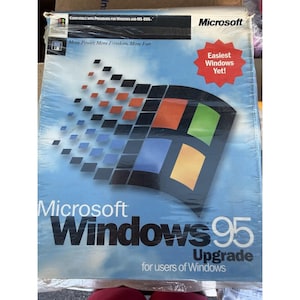 May include: A sealed retail box for Microsoft Windows 95 Upgrade for users of Windows. The blue packaging features the iconic multi-colored Windows logo, the text More Power, More Freedom, More Fun, and a red starburst reading Easiest Windows Yet!