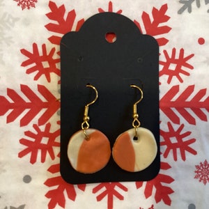 Orange and white handmade clay earrings