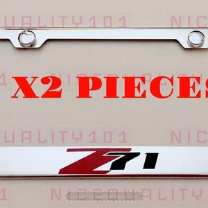 May include: Two silver license plate frames with a red and black Z71 logo. The frames are for standard US license plates. The text "X2 PIECES" is printed in red on the image.