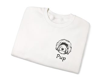 May include: White t-shirt with a black and white illustration of a dog's face and the word "Pup" printed on the front.