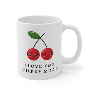 May include: White ceramic mug featuring a red cherry design. The cherries have cute faces and the text "I love you cherry much!" is printed below.