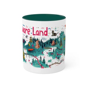 May include: White ceramic mug with a green interior. The mug features a colorful illustration of a whimsical map with the words "Ware Land" printed on the front.