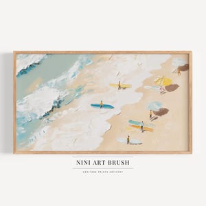 May include: A painting of a beach scene with surfers and umbrellas. The painting is done in a loose, impressionistic style with bright colors. The painting is framed in a light wood frame.