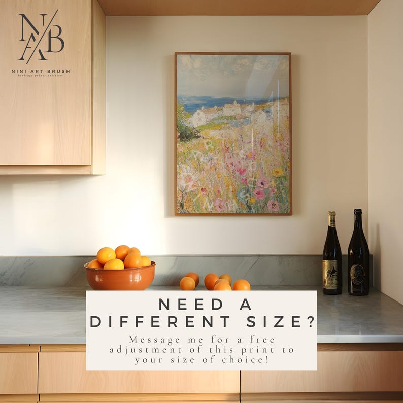 Op de afbeelding: Een ingelijst schilderij van een zeegezicht met een klein dorp in de verte. Het schilderij is in een licht houten lijst en hangt aan een muur in een keuken. De tekst "NEED A DIFFERENT SIZE? Message me for a free adjustment of this print to your size of choice!" staat onder het schilderij.