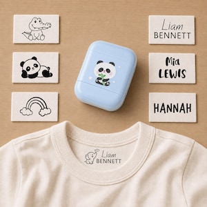 May include: A light blue stamp case featuring a panda graphic, surrounded by rectangular fabric labels with black ink prints of a crocodile, panda, rainbow, and the names Liam Bennett, Mia Lewis, and Hannah, plus a cream-colored t-shirt.