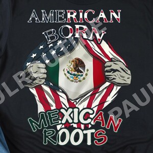 May include: Black t-shirt with the text "AMERICAN BORN MEXICAN ROOTS." The design features the American flag and the Mexican flag. The shirt is paired with blue jeans and black sneakers.