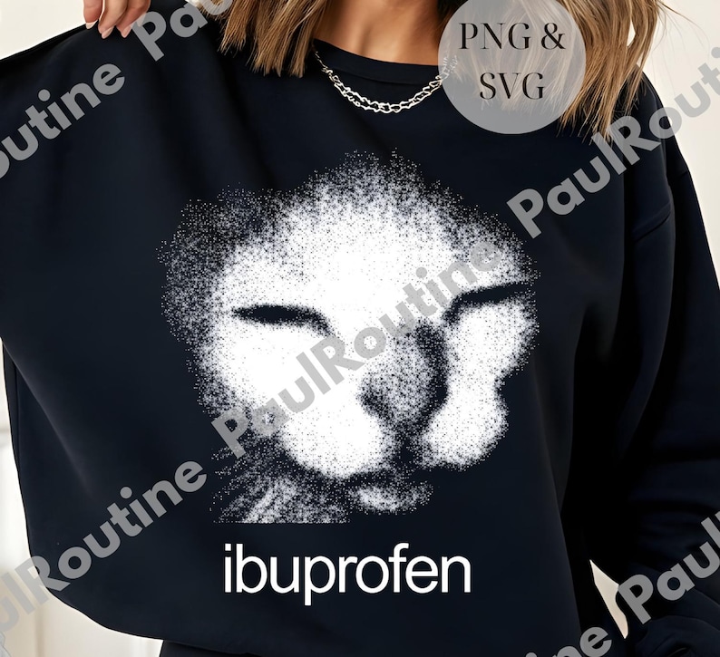 A woman wearing a black sweatshirt with a white cat face design and the text "ibuprofen" printed on it.