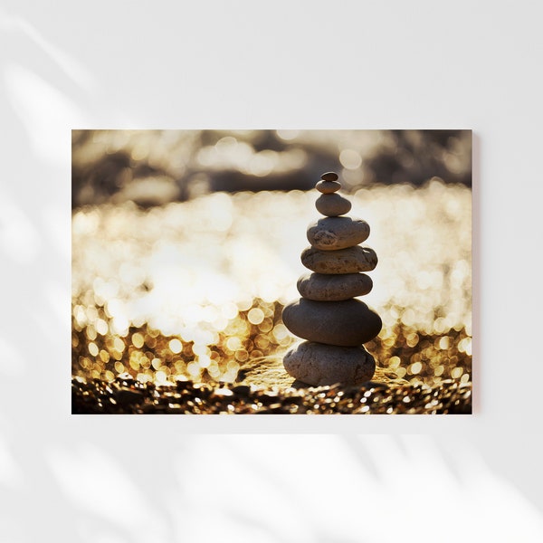 photo of digital of a pyramid of stones on the beach,solar bokeh,zen photo, balancing stones, stacked rocks or balanced pebbles,