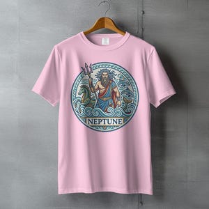 Pink t-shirt with a circular graphic of Neptune holding a trident with sea creatures.