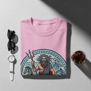 Pink sweatshirt featuring Poseidon with trident, dolphins, and horses.