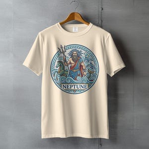 Cream t-shirt featuring a circular design of Neptune with trident, horses, and waves.