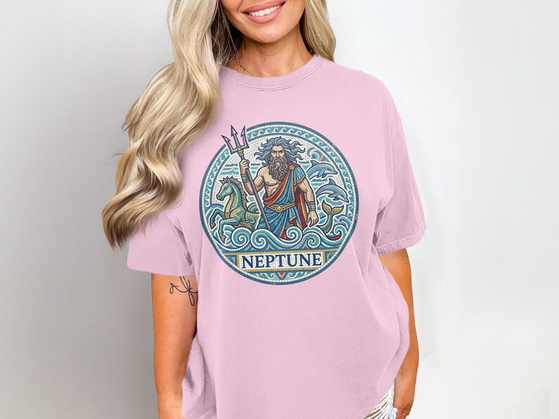 T-shirt featuring a circular graphic of Neptune with trident, horses, and dolphins.