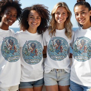 Four smiling women wear white t-shirts featuring a circular graphic of Neptune.